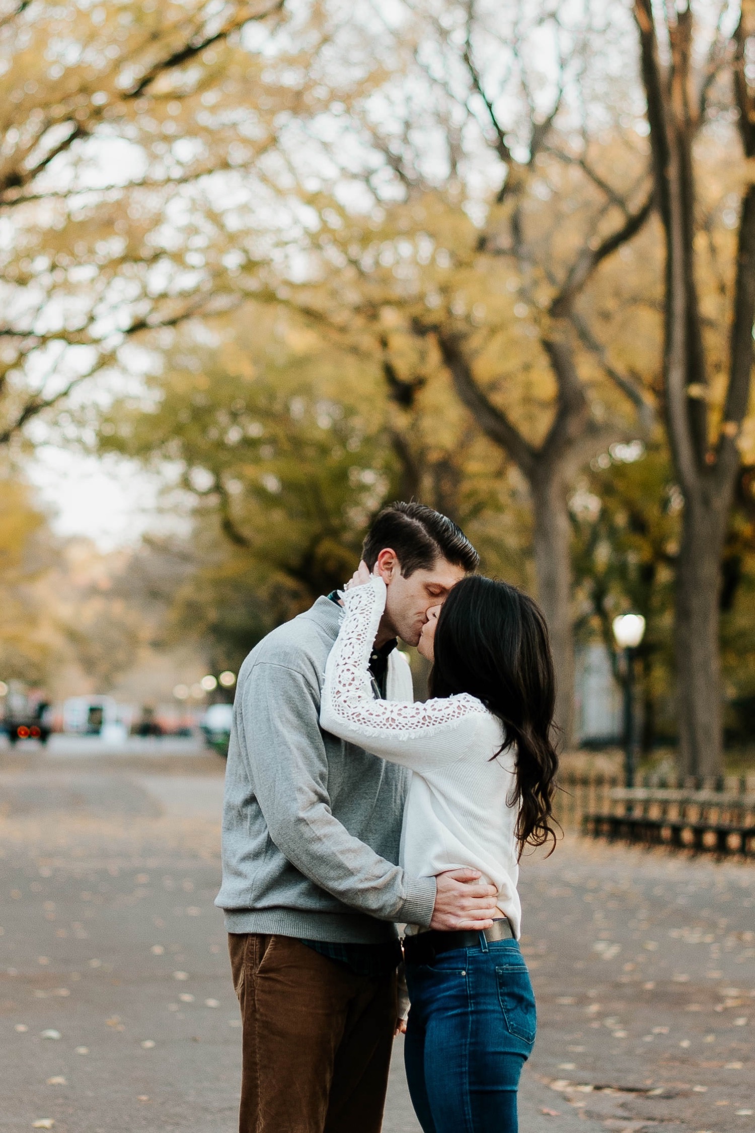engaged couple kisses in central park nyc